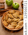 French apple pie or tart with apple slices arranged on top 129560721
