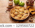 French apple pie or tart with apple slices arranged on top 129560722