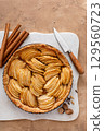 French apple pie or tart with apple slices arranged on top 129560723