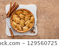 French apple pie or tart with apple slices arranged on top 129560725
