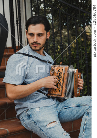 Man Playing Traditional Italian Accordion Outdoor Man Playing Traditional Italian Accordion Outdoor 129560794