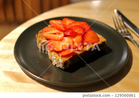 Toast with lots of strawberries Toast with lots of strawberries 129560861
