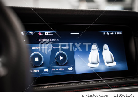 Infotainment screen in a Mercedes AMG showing seat massage controls, Apple CarPlay connectivity, and detailed seat adjustment options. Infotainment screen in a Mercedes AMG showing seat massage controls, Apple CarPlay connectivity, and detailed seat adjustment options. 129561143