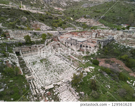 Ancient Sagalassos theater ruins on green slope in Turkey 129561628