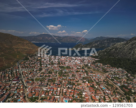 Aerial view of marmaris spreading to a vivid bay and rugged hills, Turkiye Aerial view of marmaris spreading to a vivid bay and rugged hills, Turkiye 129561703