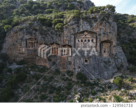 Aerial view of monumental lycian cliff tombs near Marmaris mountains, Turkiye 129561718