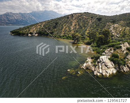 Aerial view of curved bay and olive hills on bafa lake coast, aydin, Turkey 129561727