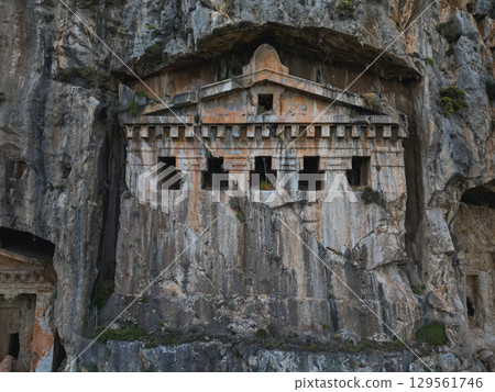 Aerial view of ornate facade carved in limestone cliff near Marmaris, Turkiye 129561746