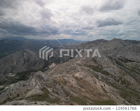Stormy ridgelines of the Taurus Mountains near Antalya, Turkey under dark clouds 129561766