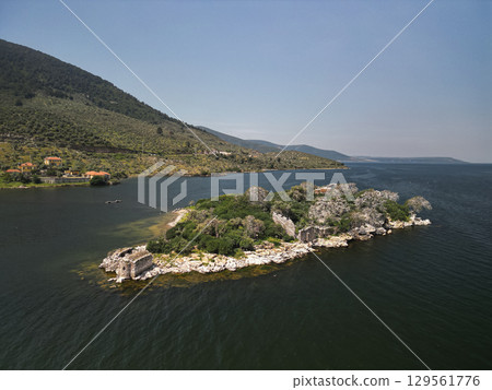 Aerial view of ancient ruins on rocky islet in bafa lake, aydin province, Turkey 129561776