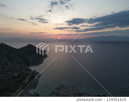 Ancient Knidos lighthouse on rugged peninsula at sunset in Turkey 129561829