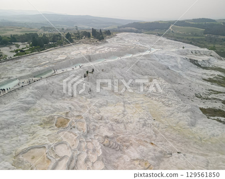 Aerial view of Pamukkale white travertine pools and terraces in Turkiye Aerial view of Pamukkale white travertine pools and terraces in Turkiye 129561850