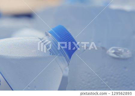Bottled water stored in ice for a refreshing drink Bottled water stored in ice for a refreshing drink 129562893