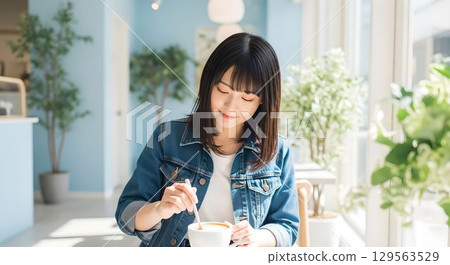 AI-generated image of a Japanese woman mixing cafe au lait at a cafe 129563529