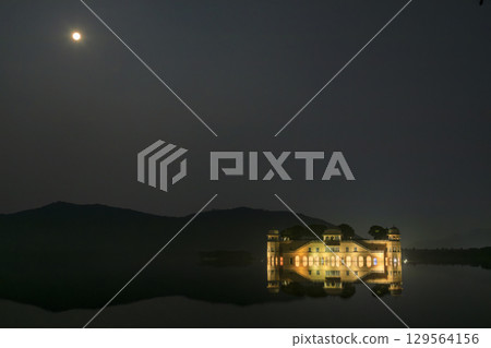 Jal Mahal and the moon floating on Man Sagar Lake 129564156