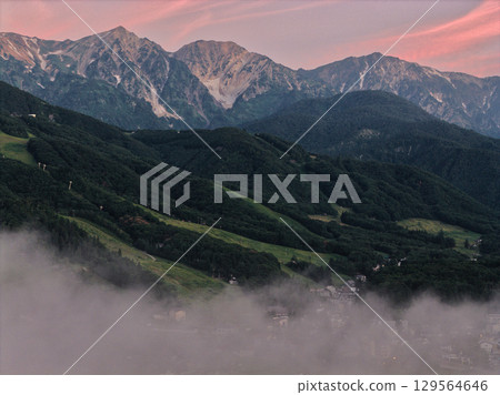 Sea of clouds, clouds dyed in the morning glow, and the Hakuba Sanzan mountains, Hakuba Village, Nagano Prefecture (aerial shot by drone) Sea of clouds, clouds dyed in the morning glow, and the Hakuba Sanzan mountains, Hakuba Village, Nagano Prefecture (aerial shot by drone) 129564646