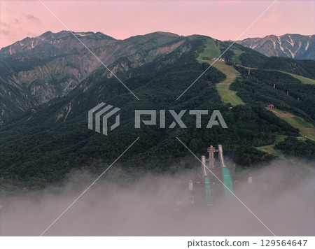 Sea of clouds, the sky dyed in the morning glow, and Mt. Karamatsu, Hakuba Village, Nagano Prefecture (aerial shot by drone) Sea of clouds, the sky dyed in the morning glow, and Mt. Karamatsu, Hakuba Village, Nagano Prefecture (aerial shot by drone) 129564647