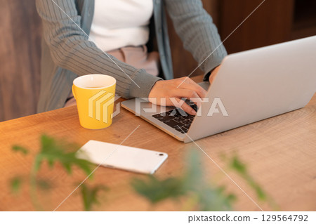 Young woman, computer, hand Young woman, computer, hand 129564792