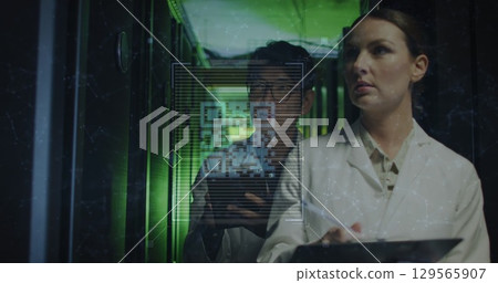 Image of data processing with qr code over diverse business people in server room Image of data processing with qr code over diverse business people in server room 129565907