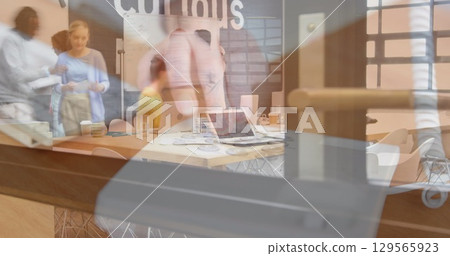Image of person using computer over group of business people Image of person using computer over group of business people 129565923