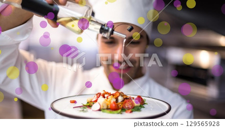 Image of falling yellow and purple dots over cook 129565928