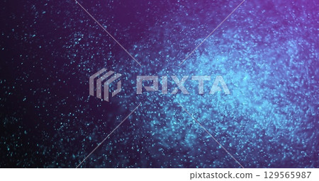 Image of blue glitter moving on violet background 129565987