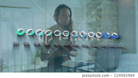 Image of graphs over caucasian teenage girl having online lessons on laptop 129565994