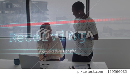 Image of receiving and data processing over diverse female coworkers in office Image of receiving and data processing over diverse female coworkers in office 129566083