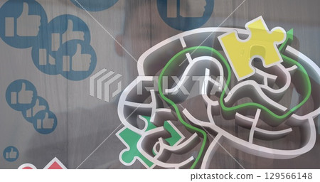 Image of colourful puzzle over man with smartphone Image of colourful puzzle over man with smartphone 129566148