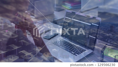 Image of data processing over african american businesswoman using laptop 129566230
