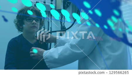 Data processing over world map against asian male doctor examining caucasian boy at hospital 129566265