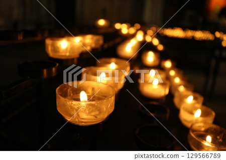 Candlelight in a European cathedral 129566789