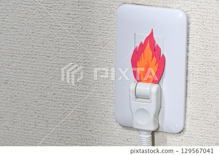 Image of a fire starting from an outlet 129567041