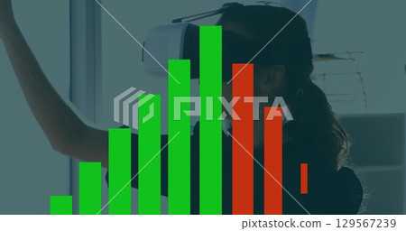 Image of financial graph over asian woman with vr headset Image of financial graph over asian woman with vr headset 129567239