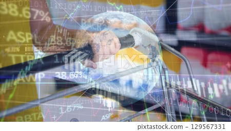 Image of data processing over hands holding shopping cart in shop Image of data processing over hands holding shopping cart in shop 129567331