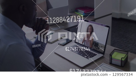 Image of numbers processing over businessman using phone headset Image of numbers processing over businessman using phone headset 129567334