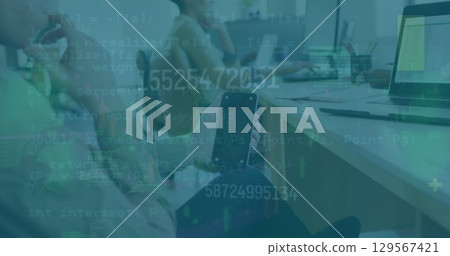 Image of numbers over hands of caucasian man with smartphone with copy space in office 129567421