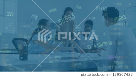 Image of numbers over diverse female coworkers in office 129567422