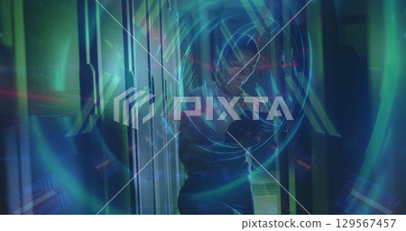 Image of tunnel made of lights over caucasian woman checking servers Image of tunnel made of lights over caucasian woman checking servers 129567457