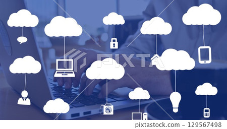 Image of clouds with icons over hands using laptop Image of clouds with icons over hands using laptop 129567498