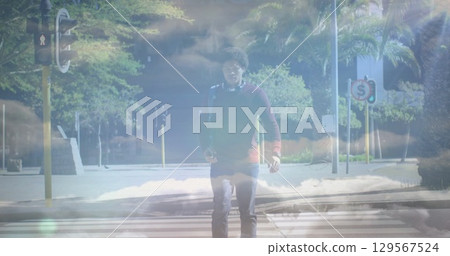 Image of clouds over african american businessman walking Image of clouds over african american businessman walking 129567524