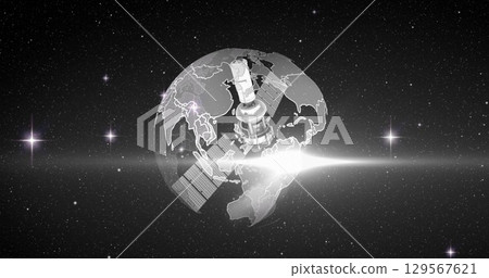 Image of satellite over globe spinning on black background Image of satellite over globe spinning on black background 129567621