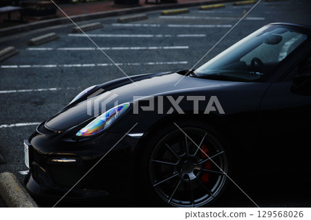 A shiny black sports car 129568026