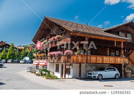 Charming Swiss Chalet Architecture Surrounded by Majestic Mountains in Grindelwald, Switzerland 129568391