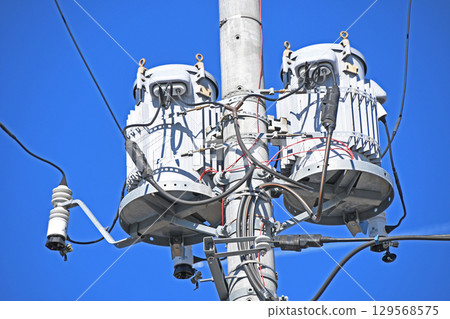 Utility poles and electrical equipment (pole-mounted transformers) 129568575