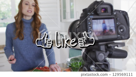 Image of like text over caucasian woman cooking, making vlog using camera Image of like text over caucasian woman cooking, making vlog using camera 129569111