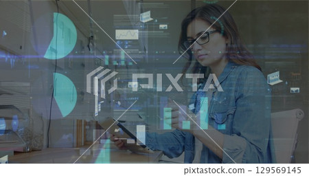 Image of data processing over caucasian businesswoman using tablet Image of data processing over caucasian businesswoman using tablet 129569145