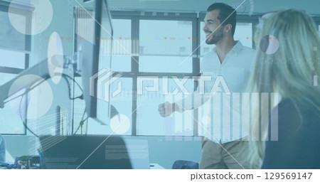 Image of financial data processing over business people walking in office Image of financial data processing over business people walking in office 129569147