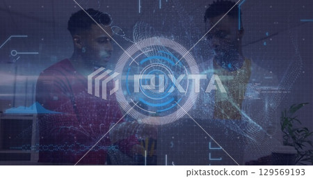 Professionals collaborating around laptop in modern office, with holographic data visualization Professionals collaborating around laptop in modern office, with holographic data visualization 129569193