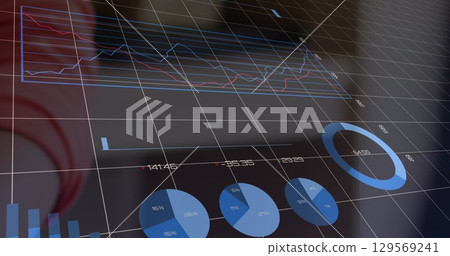 Displaying data visualization dashboard in control room, with 3D wireframe grid and multiple charts 129569241